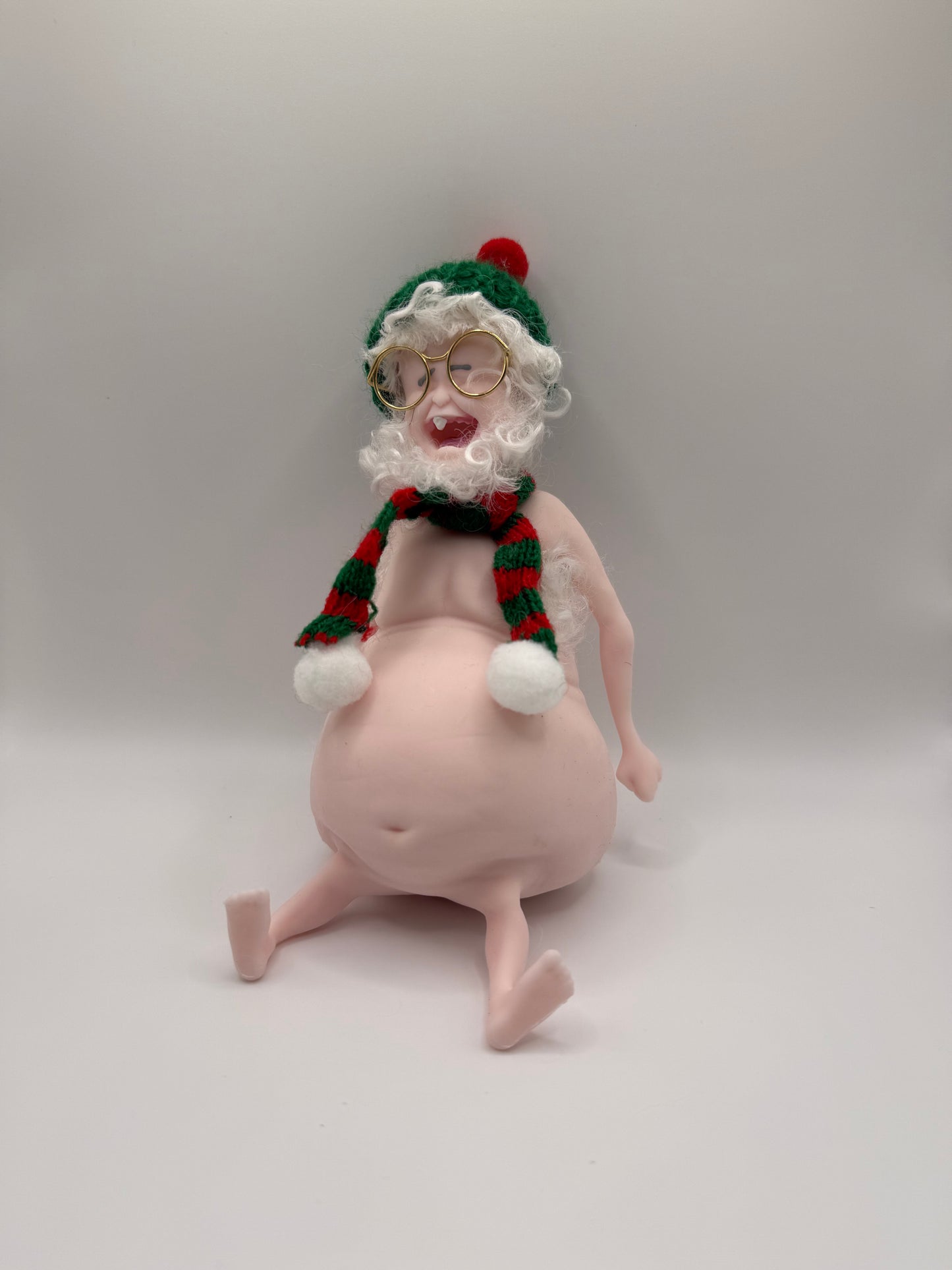THEMUGLY Rene Squishy Doll: Hairy Santa Edition with Beard, Beanie, Scarf & Glasses, Christmas Desk Ornament Stress Toy, Funny White Elephant Gag Gift