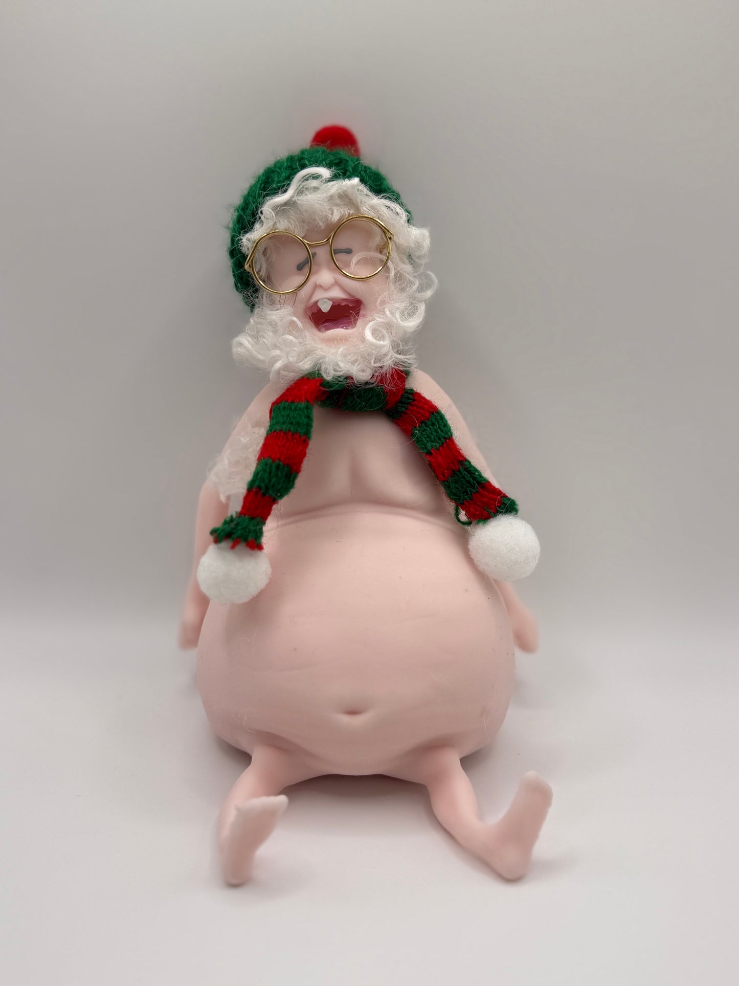 THEMUGLY Rene Squishy Doll: Hairy Santa Edition with Beard, Beanie, Scarf & Glasses, Christmas Desk Ornament Stress Toy, Funny White Elephant Gag Gift