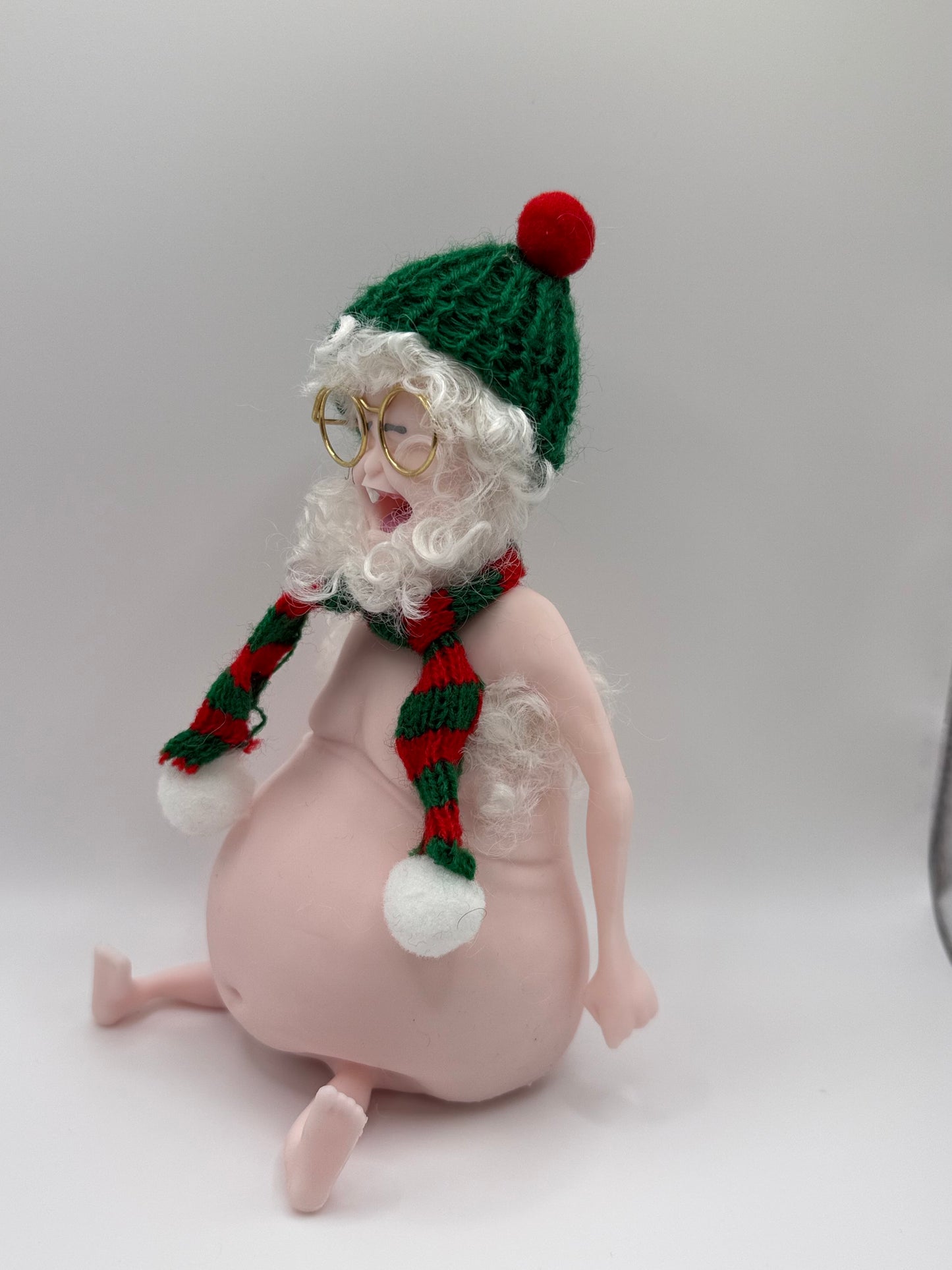 THEMUGLY Rene Squishy Doll: Hairy Santa Edition with Beard, Beanie, Scarf & Glasses, Christmas Desk Ornament Stress Toy, Funny White Elephant Gag Gift