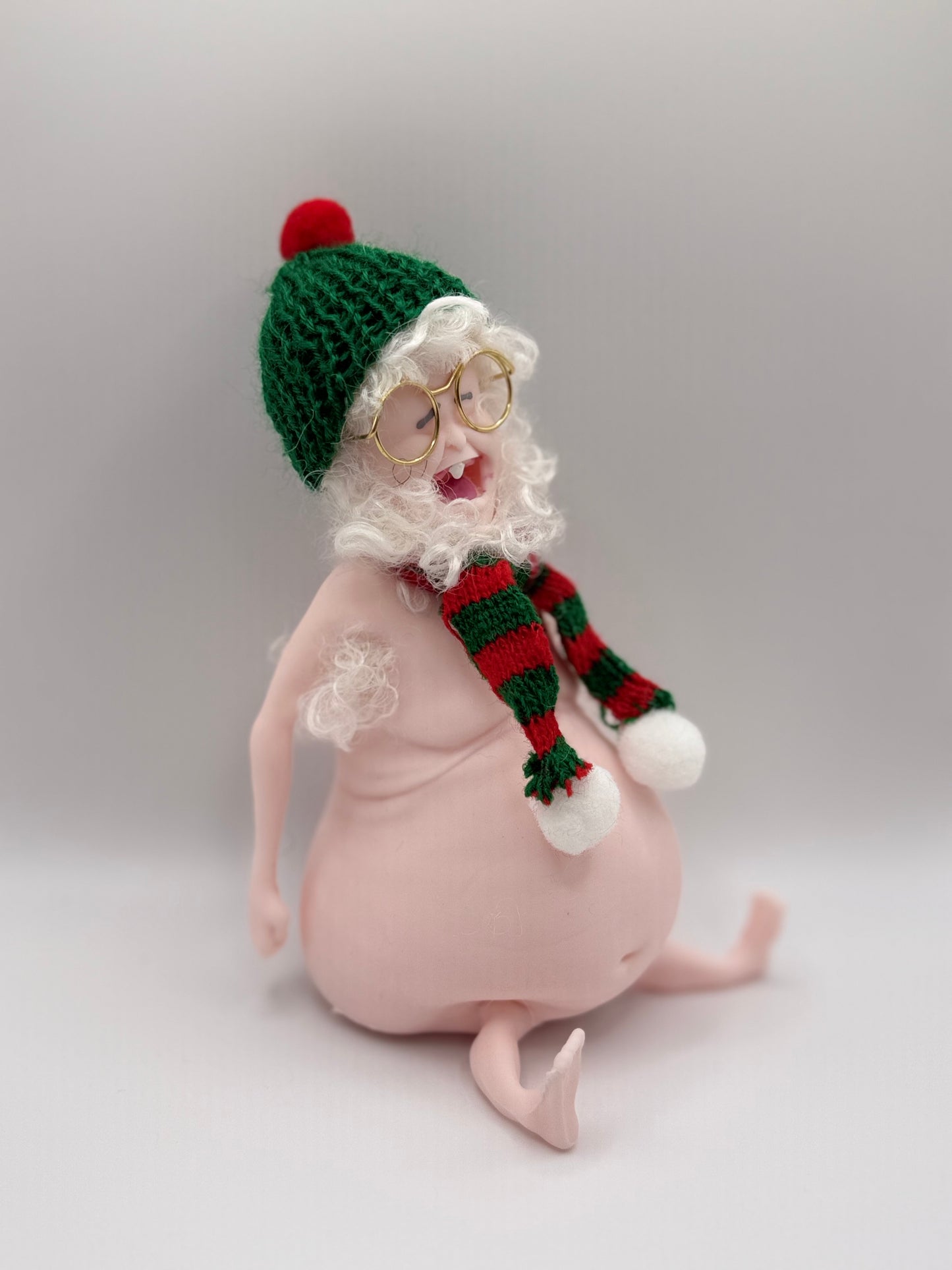 THEMUGLY Rene Squishy Doll: Hairy Santa Edition with Beard, Beanie, Scarf & Glasses, Christmas Desk Ornament Stress Toy, Funny White Elephant Gag Gift