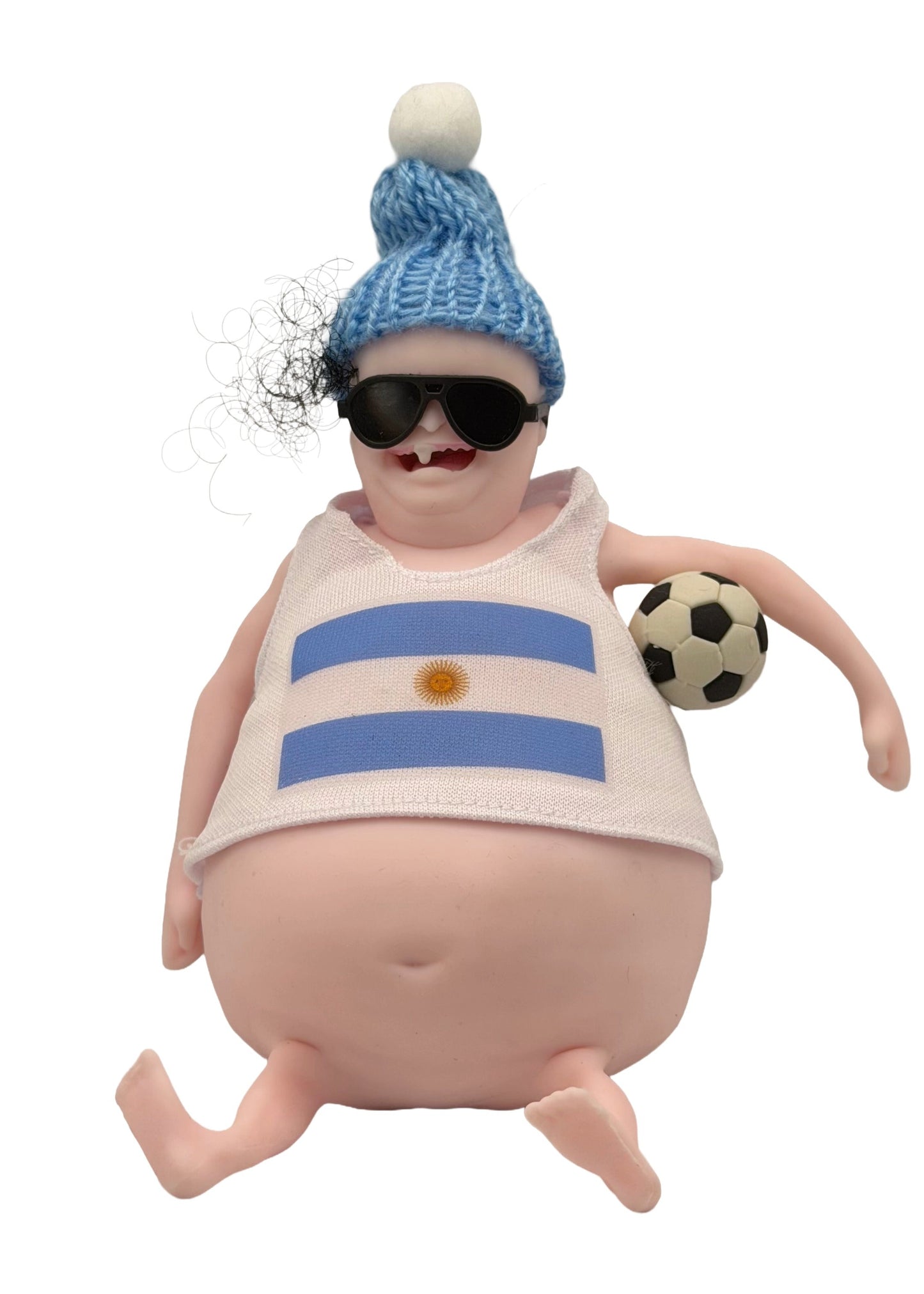 Toy figure of a baby wearing an Argentina-themed outfit with a soccer ball on a white background
